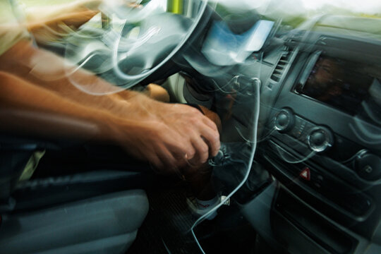 Hands Shifting Gears in a Car During Drive