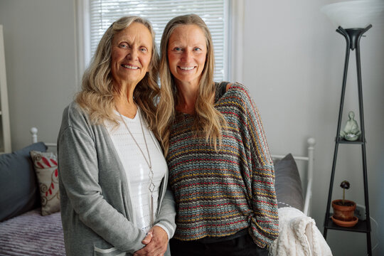 Happy mother and daughter spending quality time together inside