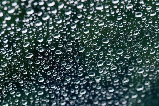 Macro View of Water Droplets on Glass Surface
