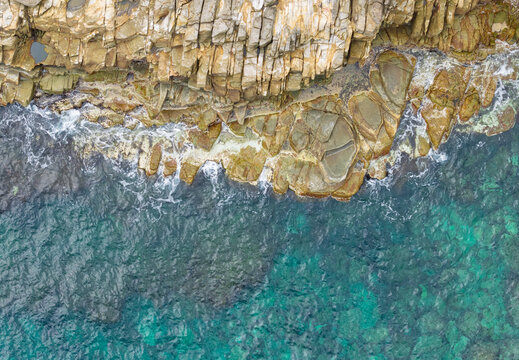 Aerial Rocky Coastline Ocean Waves Rugged Shore Top View