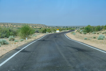 Road through the desert between Jaisalmer and Tanot, near Jaisalmer India.