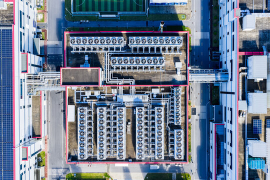 Aerial top view of industrial cooling system and pipelines in factory