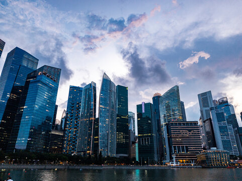 Corporate high-rise towers glowing under twilight