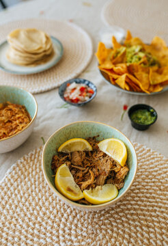 Pulled pork with lemon in ceramic bowl