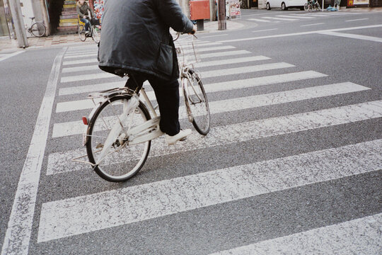 Man cycling on a crosswalk