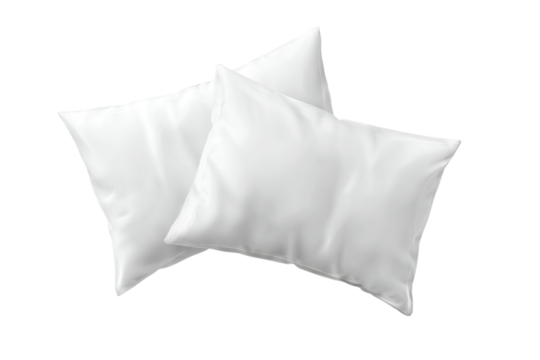 Two soft, fluffy, white pillows are slightly overlapping against a stark, black background