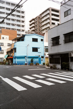 Crosswalk and blue building in the background