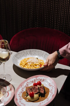 Seafood pasta with tomato, herbs, and grated cheese