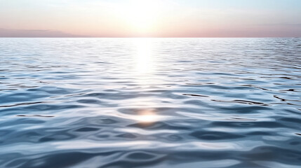 Obraz premium Calm water surface reflects soft pink light at sunrise, creating serene and emotional atmosphere