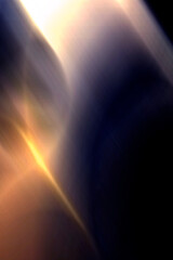 ABSTRACT BLURRED BACKGROUND The light spills onto the black background, creating an interesting abstract design—a pattern of lines and halftones that evokes various associations in your imagination.