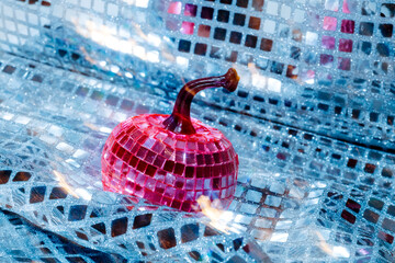 close-up of pumpkin with pink mirrored squares