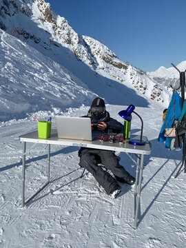 FPV drone pilot working in snowy mountains office