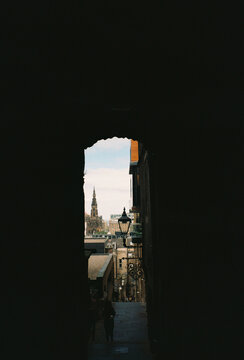 View of Scott Monument through alley in Edinburgh, Scotland
