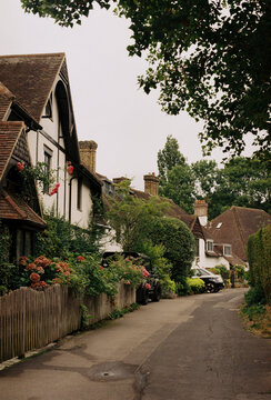 Charming English village street with cottages in England

