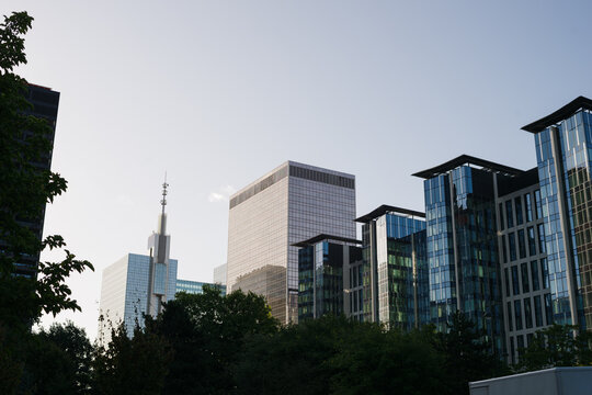 Modern Skyline Featuring Glass Buildings Under Clear Blue Sky