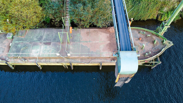 Aerial view of conveyor belt and barge for gravel processing