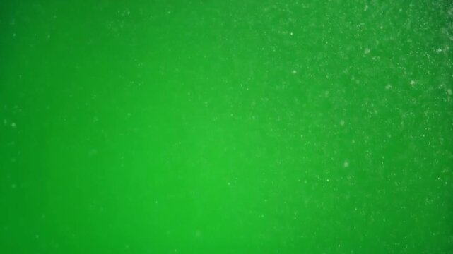 Bright green liquid with bubbles, possibly a drink or chemical solution.