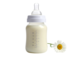 Isolated baby bottle of milk with a spoon for feeding on a white background