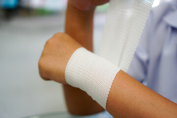Elastic Bandage for Wrist Support Demonstrated by Physiotherapist