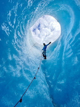 Thrilling glacier Expedition, woman Exploring Majestic ice Caverns