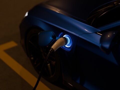 Electric vehicles charging at a charging station