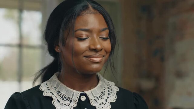 Black women looking down indoors