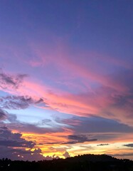 Vibrant sunset sky with purple and pink clouds