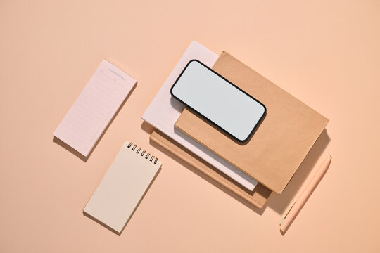 Workspace arrangement with stationery and smartphone