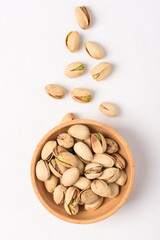 Roasted pistachios with salt, healthy snack on white background