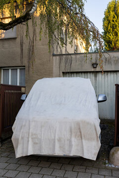 Covered up car with a tarpaulin