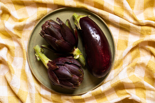 Fresh vegetables on yellow checkered background