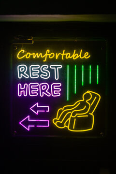 Bright Neon Sign Inviting Relaxation in a Cozy Space