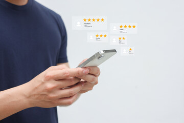 close up young man and hold smartphone and read review online website page about service and experience with many feedback and ranking score from customer for business quality and evaluation concept