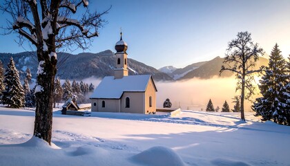 Scenic winter church scene with snow-covered ground and surrounding mountains