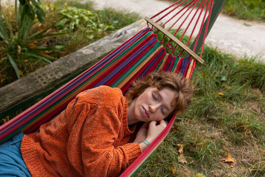 a girl dozing in a hammock
