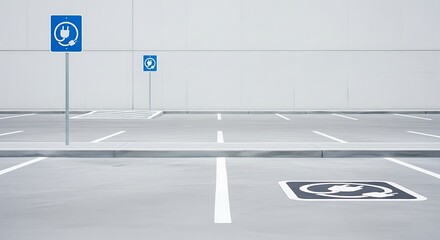 Electric vehicle charging stations in a modern parking lot with accessible parking symbol