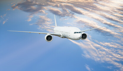 White passenger airplane flying in the sky amazing clouds in the background - Travel by air...