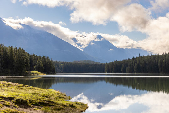 Early Morning Reflections in the water at Johnson Lake in Banff 