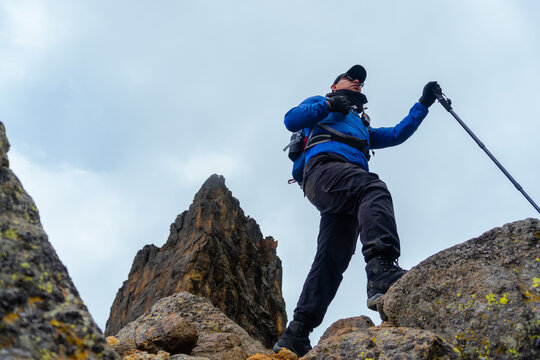 Man hiking on volcanic rocks of iztaccihuatl volcano