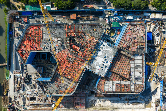 Aerial view of large construction site with cranes