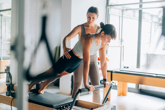 Personal Trainer Guiding Client 