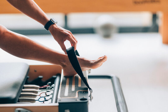 Close-Up of a Person Using Pilates Equipment 