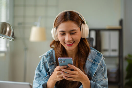 Email notification concept, woman use smartphone and laptop receive message alert in the mailbox.