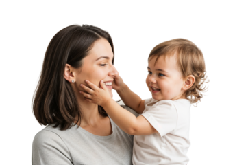 Smiling mother enjoys a joyful moment with her cheerful toddler in a bright indoor setting