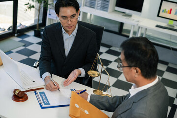 Businessman and Male lawyer or judge consult having team meeting with client, Law and Legal services concept in office.