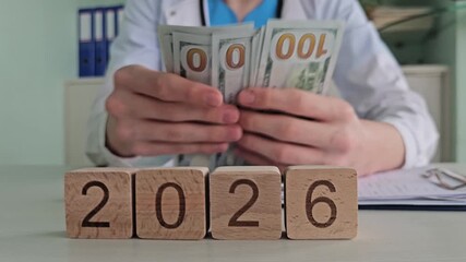 Medical professional counting cash for services in 2026