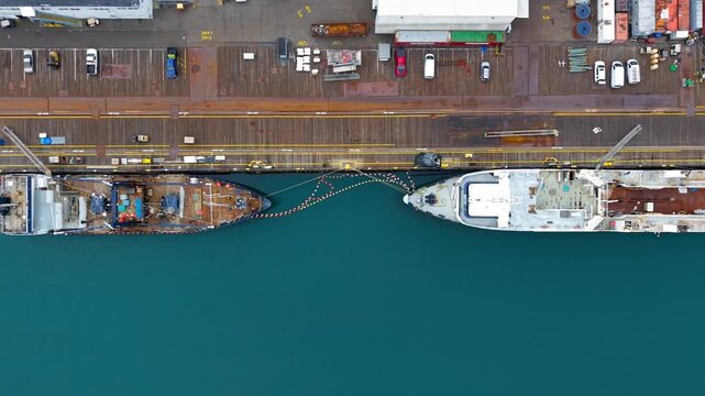 Aerial top down view of Port of Tacoma ships in a row at loading dock ,Tacoma is a major industrial city in the state of Washington.