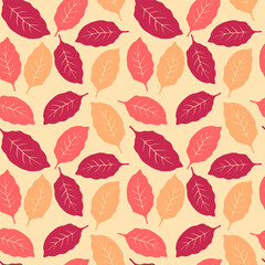 Vibrant seamless pattern with stylized autumn leaves in warm red and orange tones
