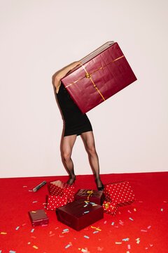 Person Carrying Giant Gift Box At Party