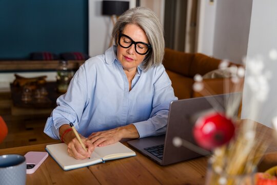 Focused journaling with laptop